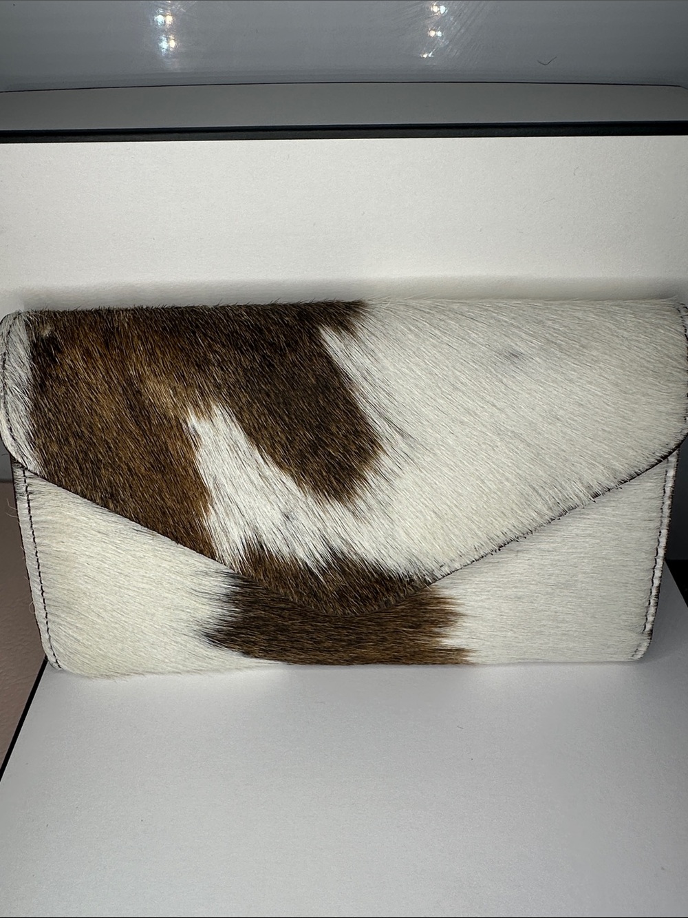Womenโs Brown and White Haircalf Envelope Clutch